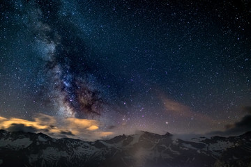 Wall Mural - the colorful glowing core of the milky way and the starry sky captured at high altitude in summertim