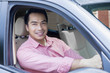 © Creativa Images - Asian man driving his car