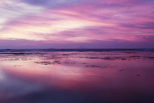 Beautiful Sunset With Purple Sky On Beach