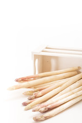 Wall Mural - Bunch of white asparagus spears in a box, on white background and copy-space