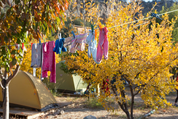 Children Clothing hanging on rope for drying after washing