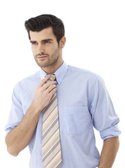 Poster - Young man fixing tie