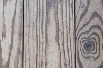 Wood texture, old natural boards without additional processing, are located vertically, the wood is damaged in the form of small cracks and scrapes, exfoliation, abstract background