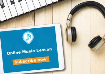 online music lesson banner on table with music instruments