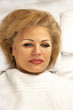 © Veselka - Face of lying aged beautiful woman in white towel