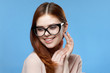 © SHOTPRIME STUDIO - happy woman with glasses looks away