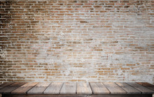 Empty Top Wood Table Over Grunge Brick Wall Background. For Product Display Montage.