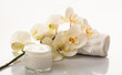 © Rawf8 - Moisturizing cream and orchid on white background