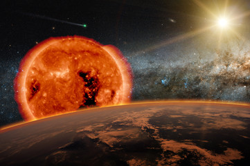 Wall Mural - old sun over the dark planet earth. a new star is born in the universe. a comet runs in the space. e