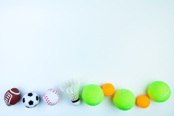 Ping pong ball, Football toy, Shuttlecock,Tennis ball, Basketball toy and Rugby toy isolated on white background with copy space.Concept winner of the sport.