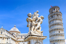 Pisa, Italy. The Fountain With Angels, And The Leaning Tower Of Pisa 