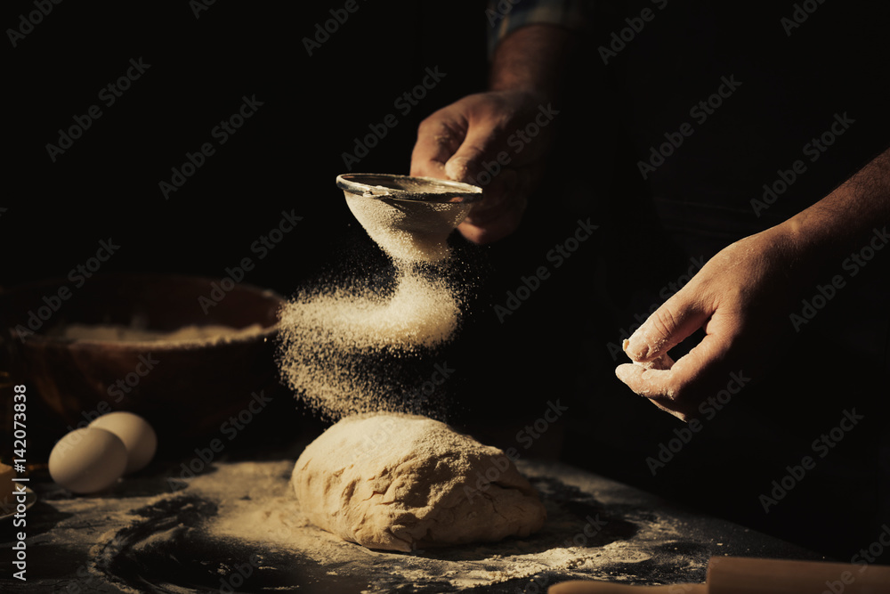 Man making dough in kitchen