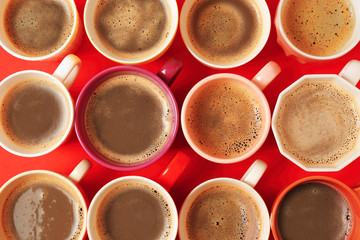 Poster - Cups of coffee on red background