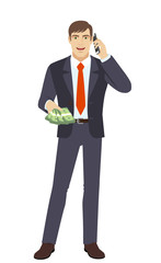 Businessman with cash money talking on the mobile phone