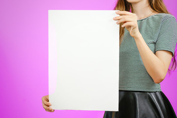 Woman showing blank white big A2 paper. Leaflet presentation. Pamphlet hold hands. Girl show clear offset paper. Sheet template. Booklet design sheet display read first person.