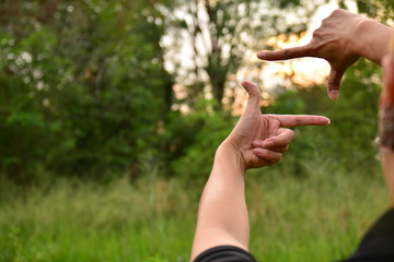 hand symbol that means frame on nature background