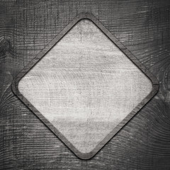 Wall Mural - gray wooden lozenge with frame on dark wall