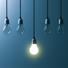 Fototapete - One hanging light bulb glowing different and standing out from unlit incandescent bulbs with reflection on dark cyan background , leadership and different business creative idea concept. 3D rendering.