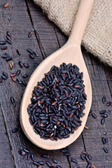 Wall Mural - Spoon with black rice