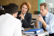 © Svyatoslav Lypynskyy - Business representatives communicating with young man and asking him to tell about his previous experience. Happy HR specialists of company taking interview.