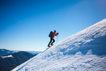 Climber in the winter mountains.