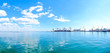 Panorama of the sea port. Cranes and ships. Bulk carrier ship in the port on loading.