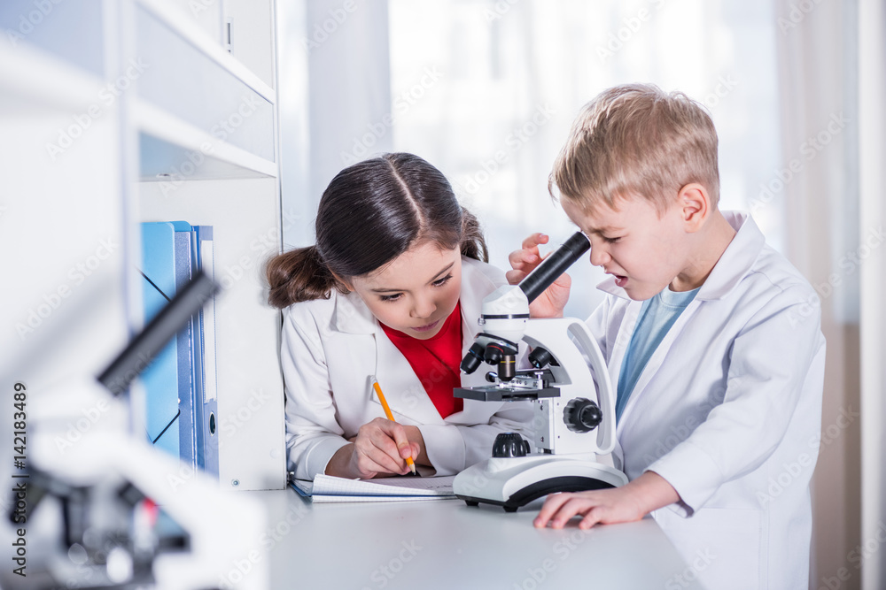 Kid Using Microscope Kids using microscope Stock Photo | Adobe Stock