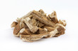 Pile of dried and sliced marshmallow root (Althaea officinalis) isolated on white background