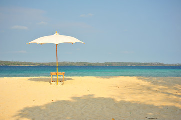  White Sand Beach with Beach Umbrella in Summer Season
