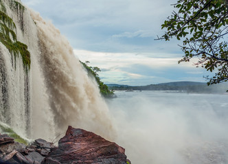 Wall Mural - Side view of the Hacha falls in the lagoon of Canaima national park after the storm - Venezuela, Latin America