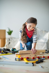 Wall Mural - Little girl with tools