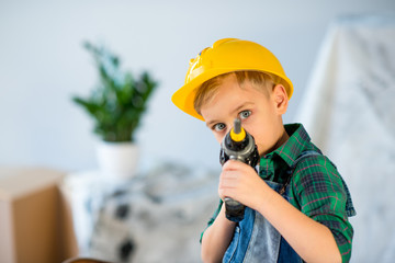 Wall Mural - Little boy with toy drill