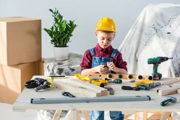 Wall Mural - Little boy with tools