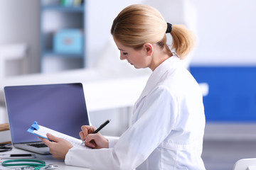 Wall Mural - Female doctor at work in clinic