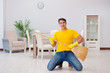 © Elnur - Funny man playing virtual guitar with broom