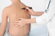 © Africa Studio - Incorrect posture concept. Physiotherapist examining and correcting boy's back