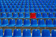 © ProstoSvet - Dark blue rows of seats on the stadium. One red seat.