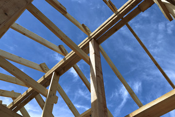 Installation of wooden beams at construction