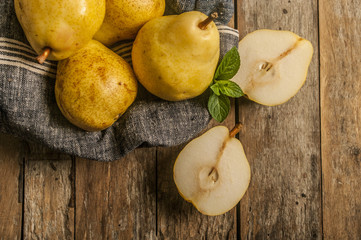 Wall Mural - Fruit background. Fresh organic pears on old wood. Pear autumn harvest