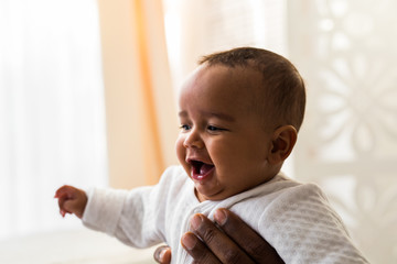 Wall Mural - adorable african american baby boy indoors