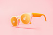 Beach sunglasses summer concept on pink background