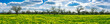 Springtime scenery beautiful wide landscape panorama with fresh spring meadow and trees