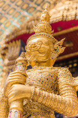 Wall Mural - Closeup beautiful Golden Giant in Wat Phra Kaew or the Temple of the Emerald Buddha or Wat Phra Sri Rattana Satsadaram, Bangkok Thailand.