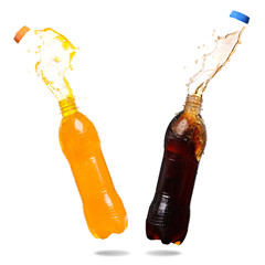 Wall Mural - Orange juice and cola splash out of bottle on white background.