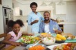 © WavebreakMediaMicro - Portrait of family having meal on dinning table at home