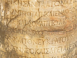 Fototapeta Miasto - Ancient marble Hellenistic text column on the ruins of the ancient city of Side