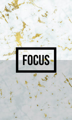 Focus motivational quote on modern marble texture.