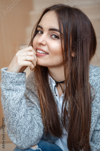 Closeup portrait of smiling Caucasian brunette young ...