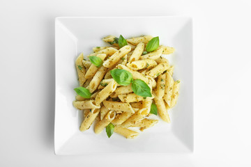 Poster - Plate with delicious pasta on white background