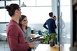 © WavebreakMediaMicro - Business executives discussing over digital tablet in office
